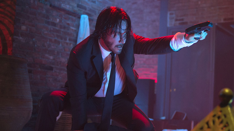 Keanu Reeves pointing a gun