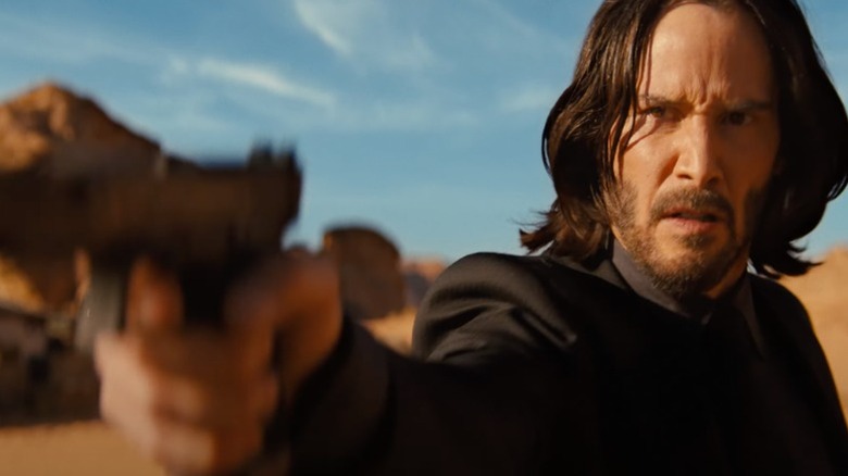 John Wick holding a gun