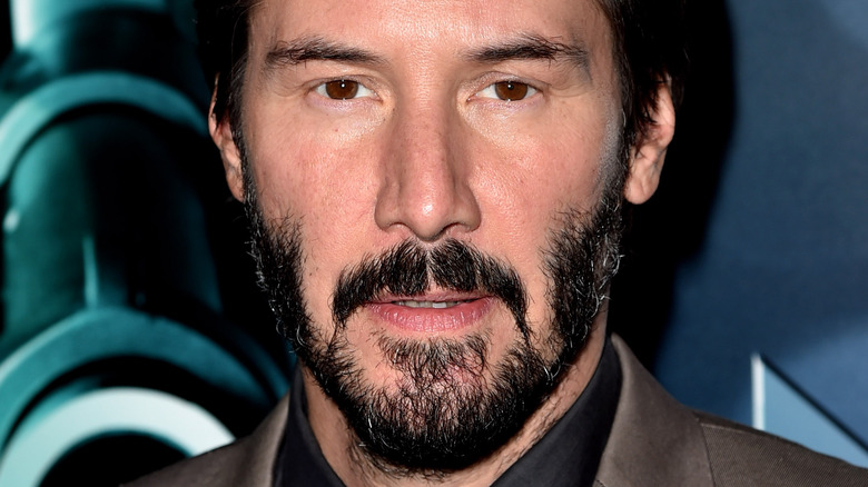 Keanu Reeves staring ahead