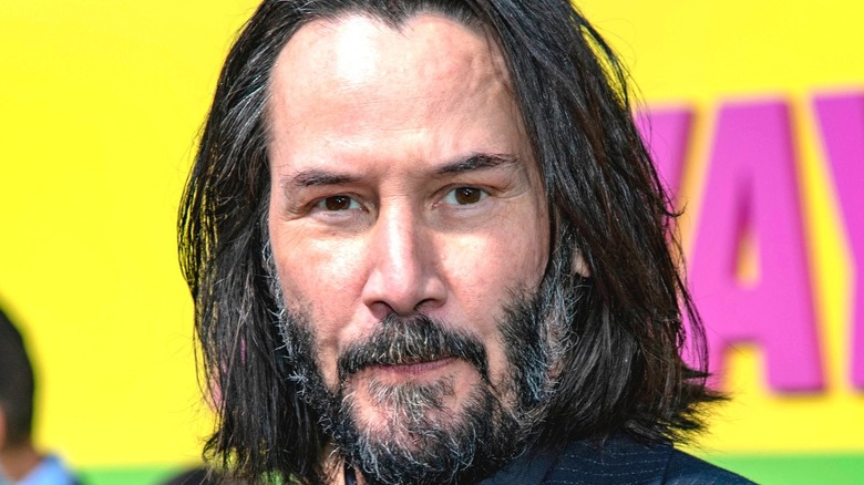 Keanu Reeves smiles