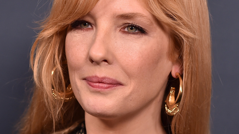 Kelly Reilly closed mouth big earrings 