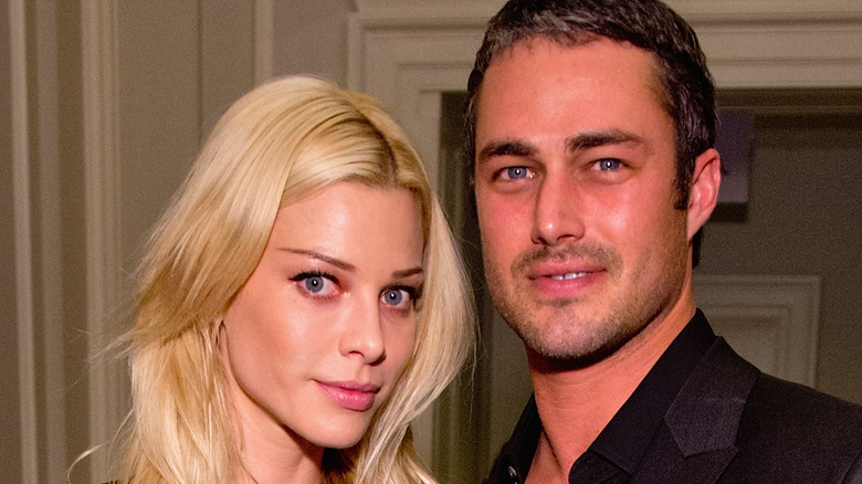 Lauren German and Taylor Kinney close up
