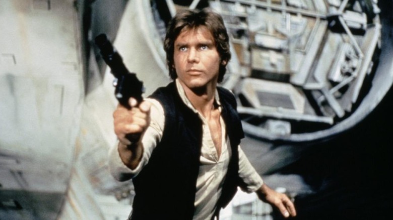 Han Solo aims his blaster