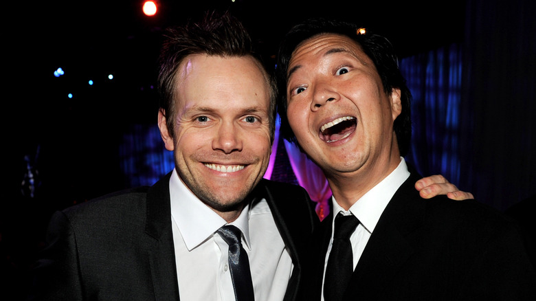 Joel McHale and Ken Jeong smile