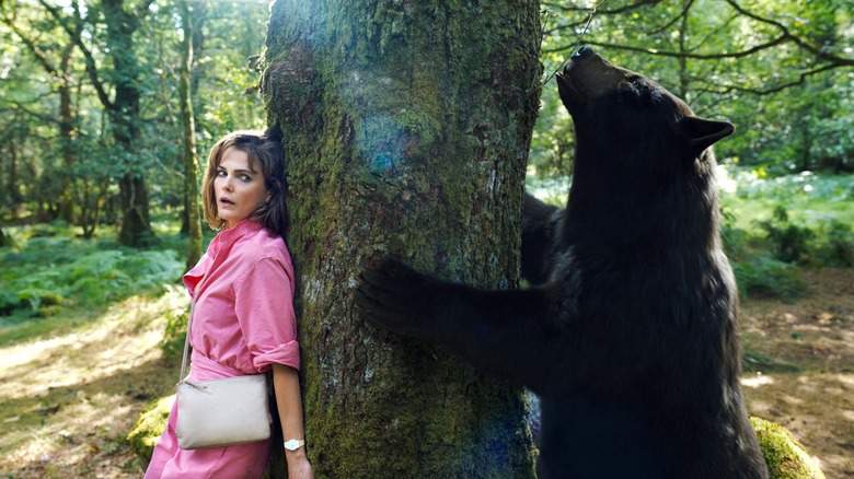 Keri Russell hiding from the bear in Cocaine Bear