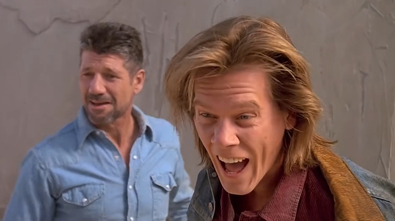 Val laughing next to Earl in Tremors