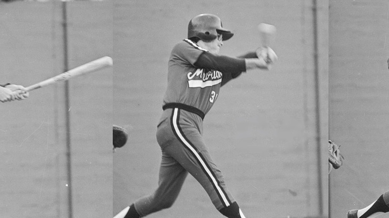 Kurt Russell warming up with bat