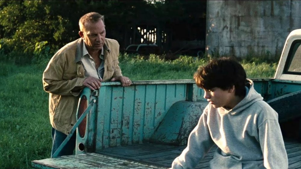Kevin Costner as Johnathan Kent and Dylan Sprayberry as 13-year-old Clark Kent in Man of Steel