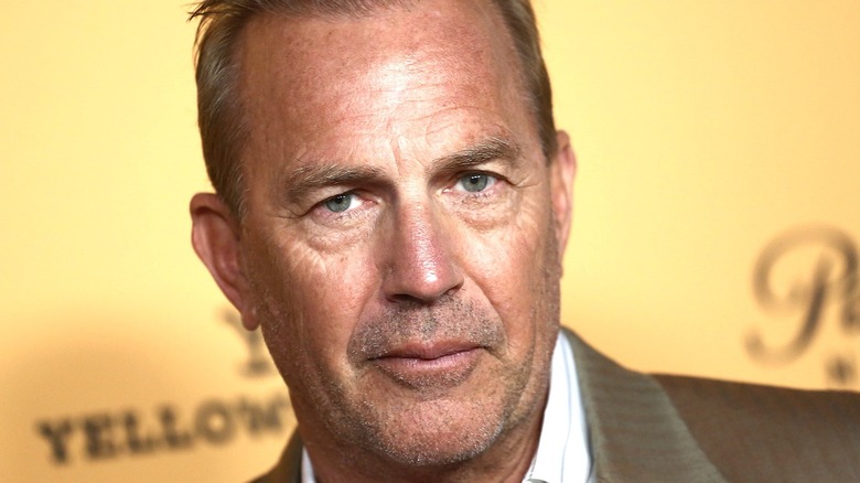 Kevin Costner in tan suit