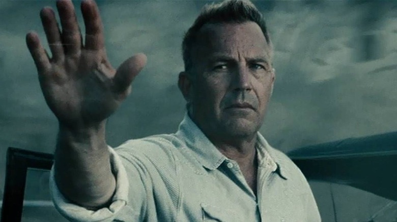 Kevin Costner raises his hand