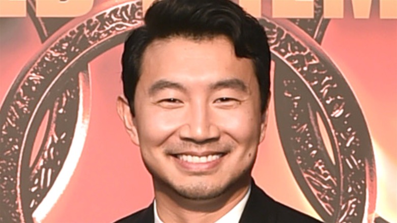 Simu Liu smiling wide