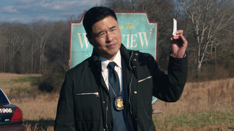 Jimmy Woo in WandaVision, holding a business card