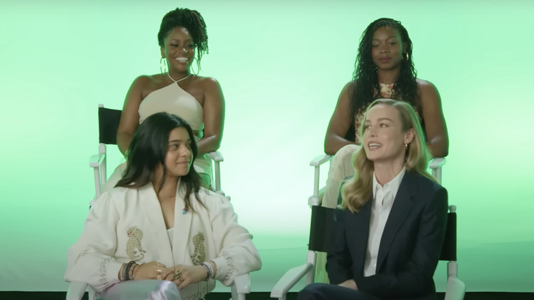 Brie Larson, Iman Vellani, Teyonah Parris, and director Nia DaCosta talking together about The Marvels