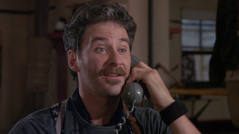 Otto speaking on the phone, perplexed