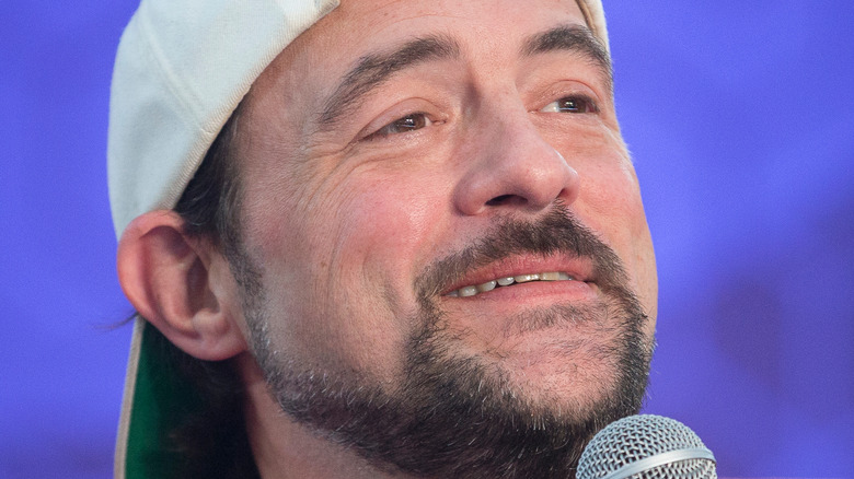 Kevin Smith talking to an audience with a microphone 