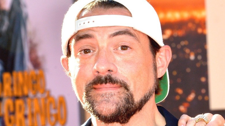 Kevin Smith wearing backward cap