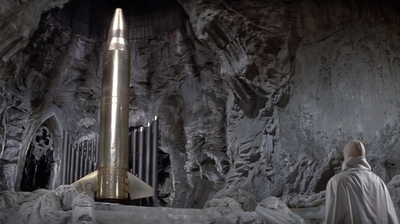 Mendez stands before the Alpha-Omega Bomb