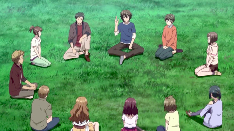 kids sitting in circle on grass