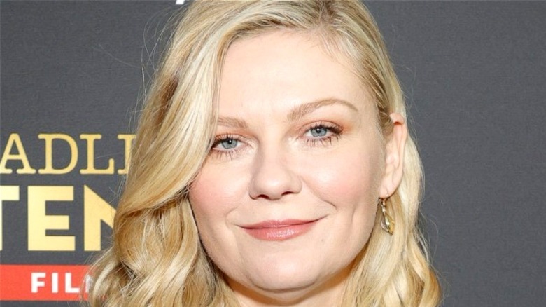 Kirsten Dunst smiling at event