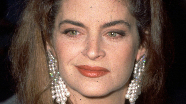 Kirstie Alley smirks.