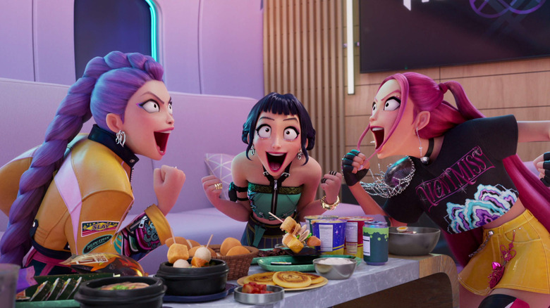 Rumi, Zoey, and Mira yell in celebration over food in KPop Demon Hunters.