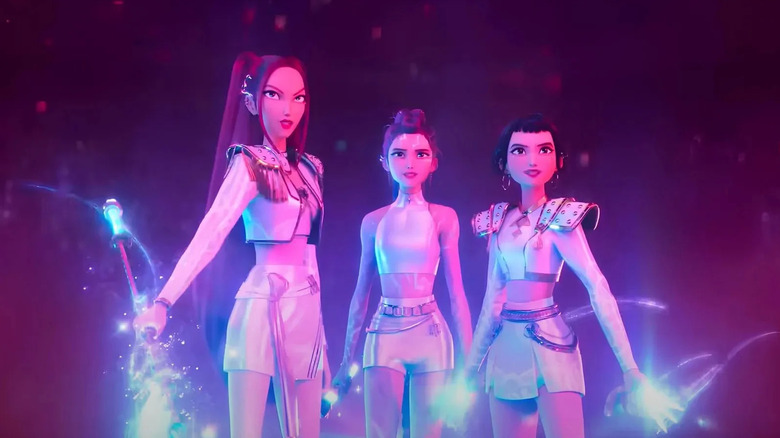 Mira, Rumi, and Zoey stand with their weapons side by side in KPop Demon Hunters