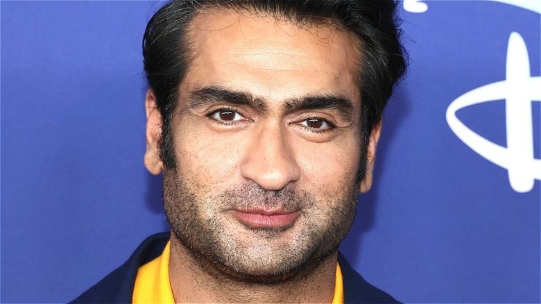 Kumail Nanjiani smirking