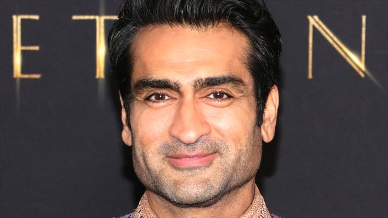 Kumail Nanjiani smiling at Eternals premiere