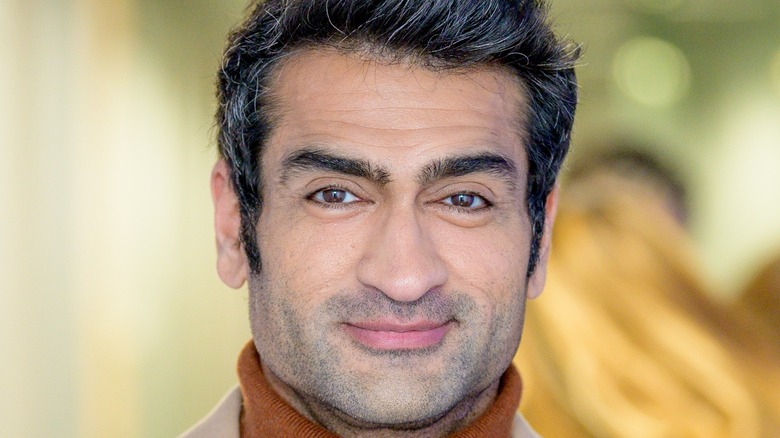 Kumail Nanjiani wearing turtleneck sweater