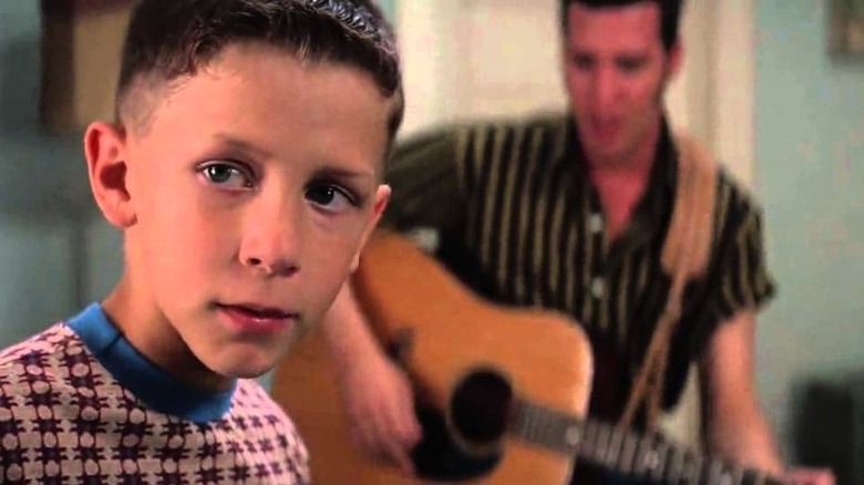 Forrest in his pajamas listening to Elvis play guitar in Forrest Gump (1994)