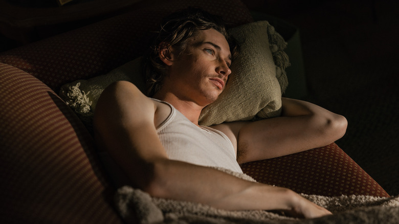 Cooper pouts on the couch in "Landman"