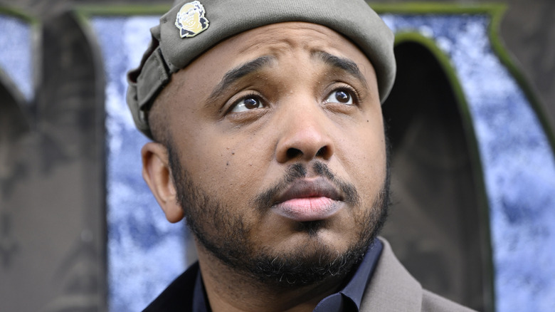 Justin Simien looking on