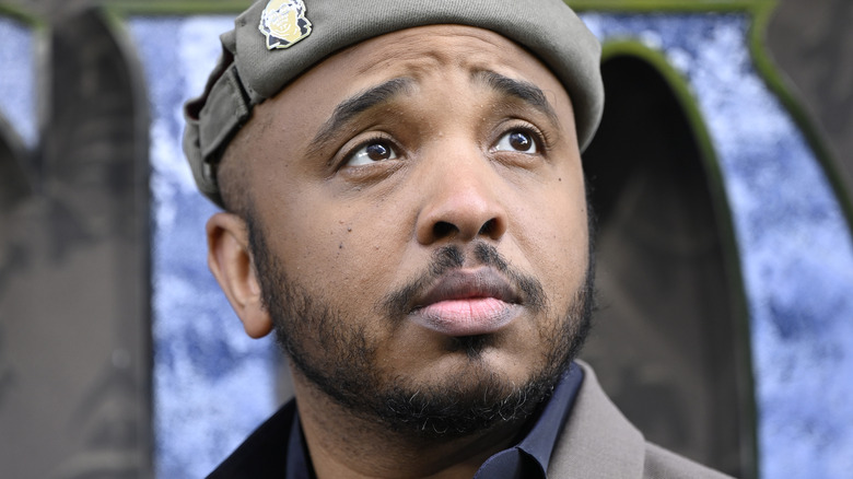 Justin Simien looking on