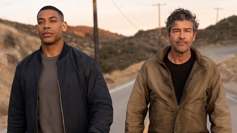 John Stewart and Hal Jordan walking down a road on Lanterns
