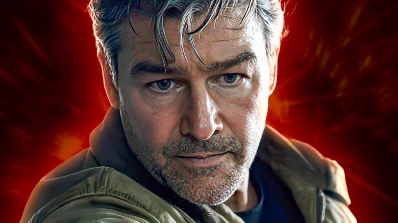 Hal Jordan looking thoughtful in front of a red background on Lanterns