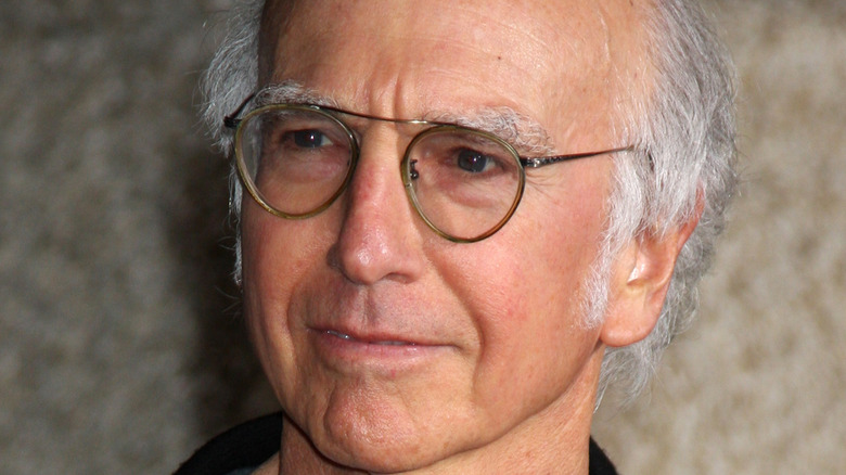 Larry David looking left