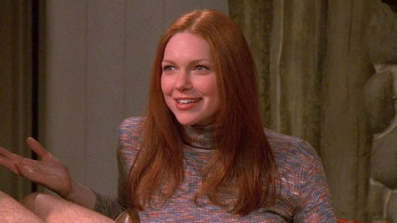 Donna Pinciotti shrugging on couch