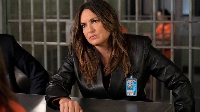 Olivia leaning across table