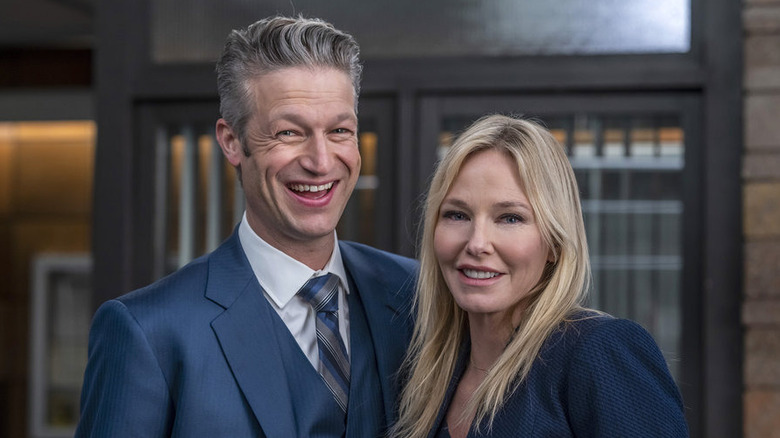 Kelli Giddish and Peter Scanavino smile together