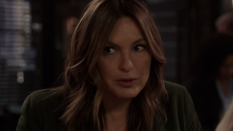 Benson discussing case in precinct