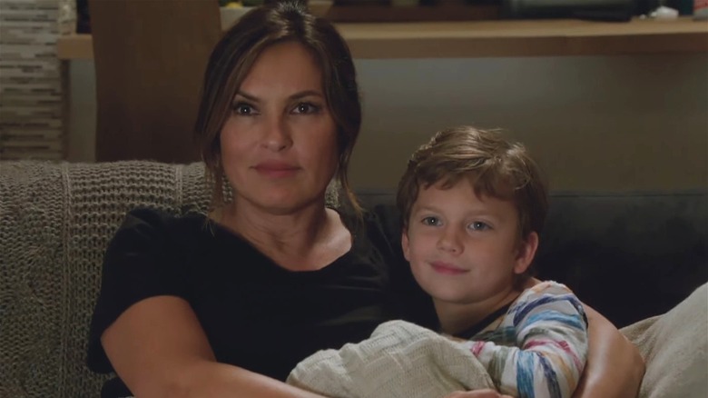 Benson sitting on the couch with Noah