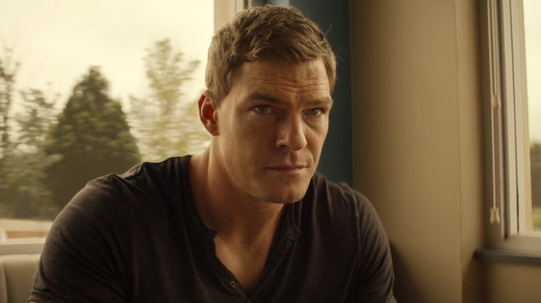 Jack Reacher sitting at a table