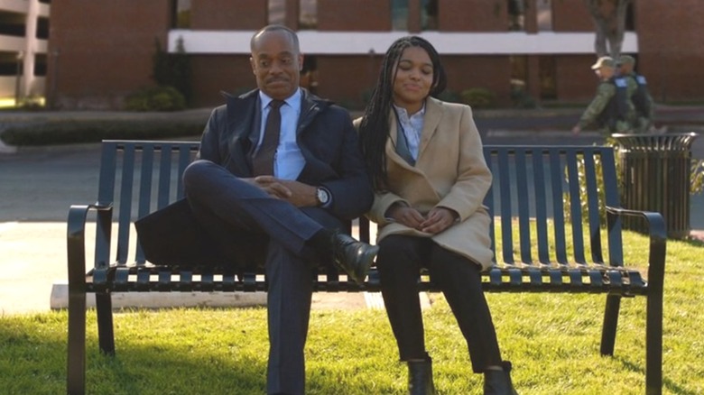 Kayla and Leon Vance sit on a park bench together in "NCIS" (2003-present)