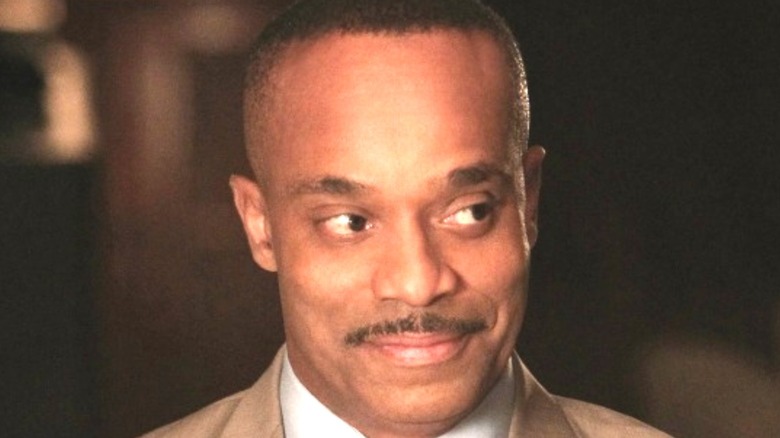 Leon Vance smiles at someone