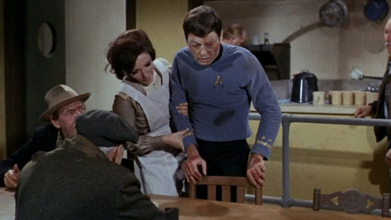 Edith takes a sickly McCoy by the arm in "Star Trek: The Original Series" (1966-1969)