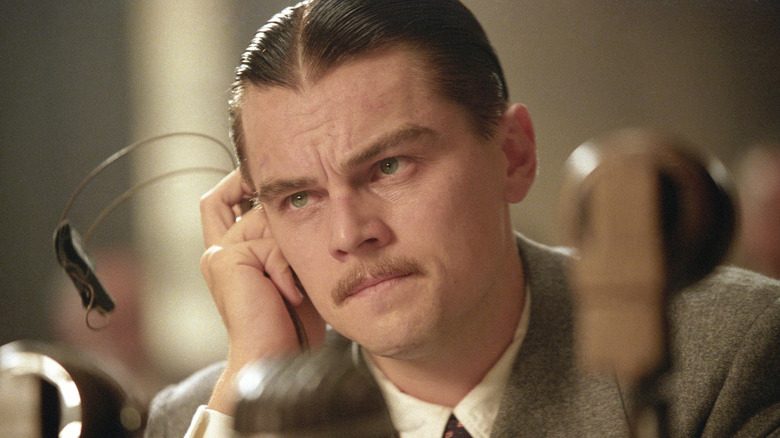 Howard Hughes listens on a headset in The Aviator