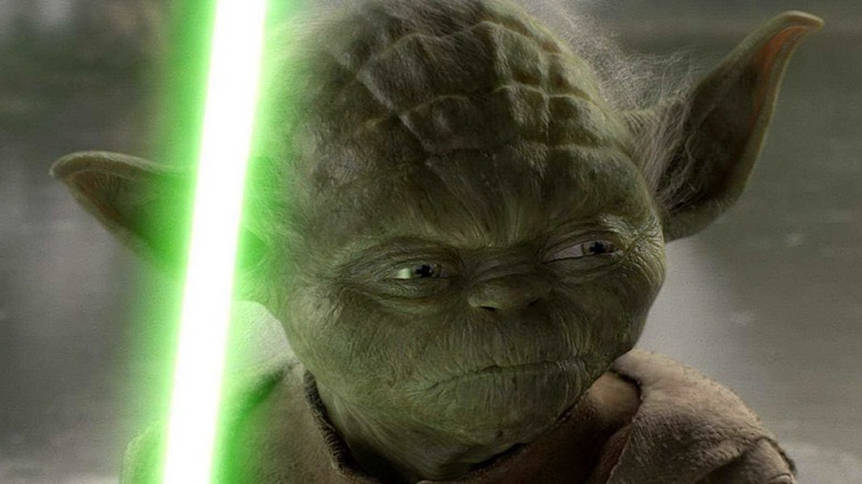 Yoda ignites his lightsaber
