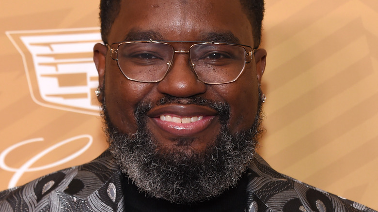 Lil Rel Howery smiling and wearing glasses