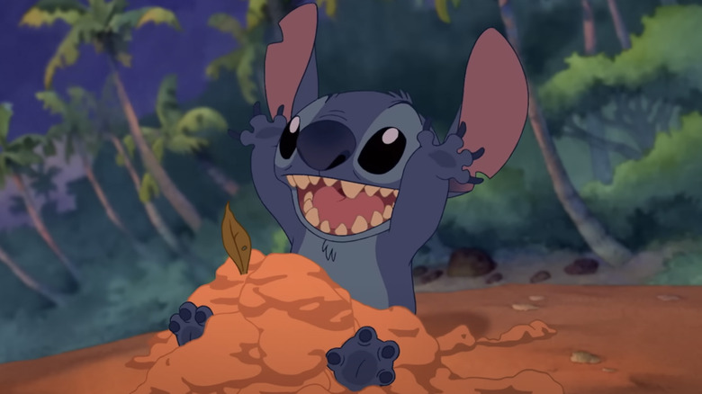 Stitch happy playing in sand