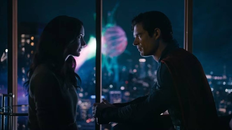 Lois and Clark talking with a giant orb outside in Superman (2025)
